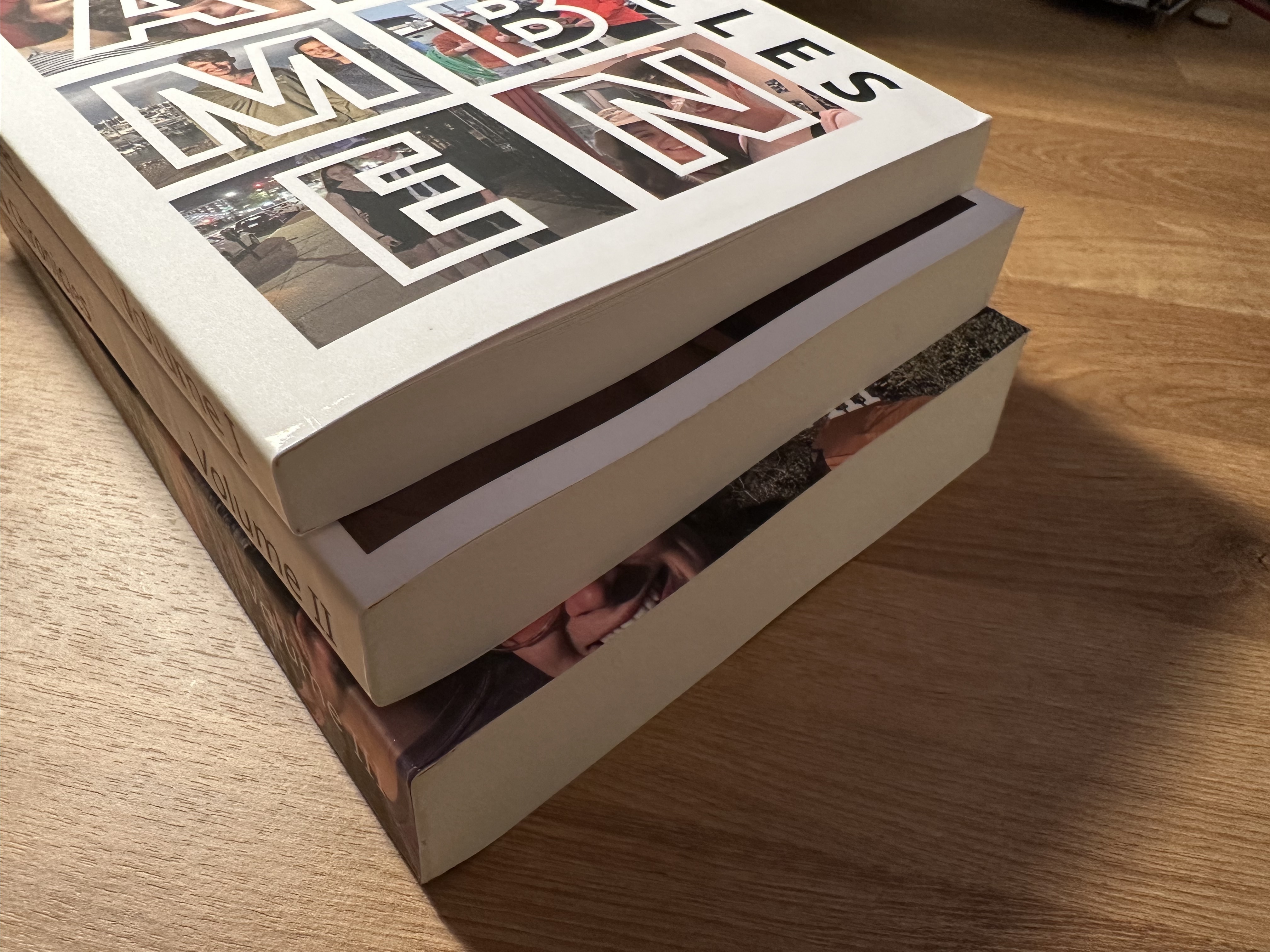 A stack of three paperback books, with pictures of a couple on the cover.